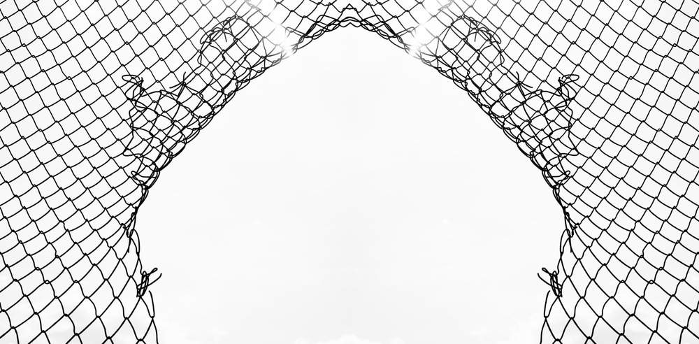 Breached net or fence with access for hackers.